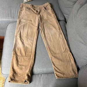 Tan Carhartt work pants.